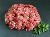 Thumbnail for grass fed grass finished ground lamb with a sprig of parsley.