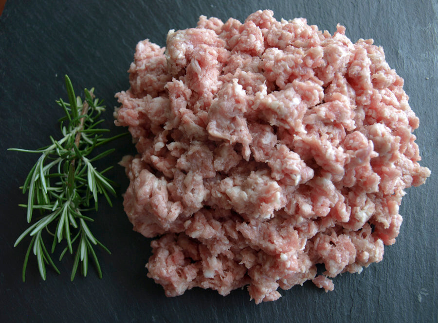 Turly pastured ground pork with a sprig of rosemary.