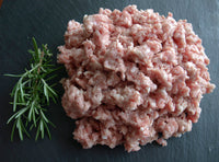 Thumbnail for Turly pastured ground pork with a sprig of rosemary.