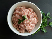 Thumbnail for Ground organic turkey in a bowl with sprigs of parsley.